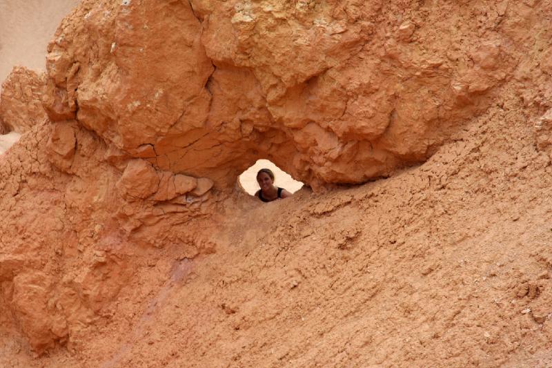 R08_6580.jpg - Jessie peeking through a hole in the rock