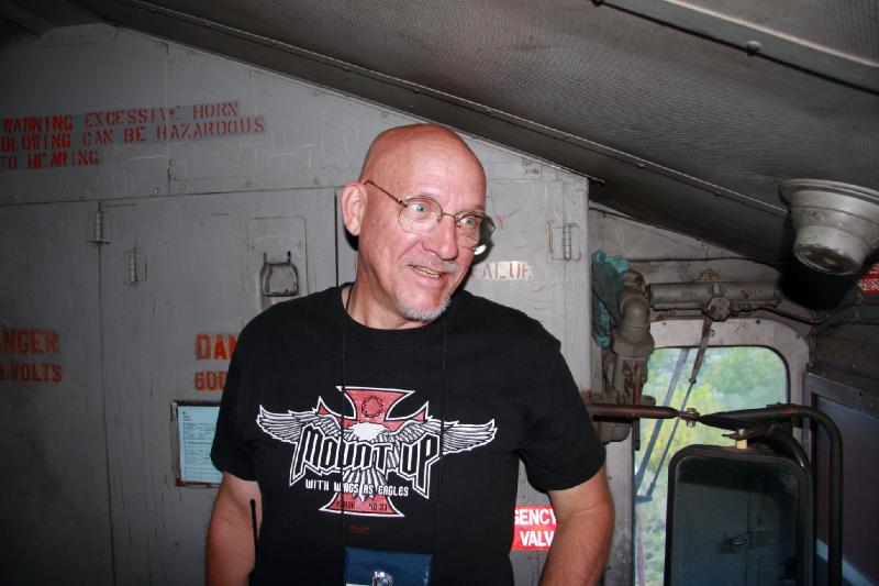 R08_6858.jpg - Steve Rowe is a train fanatic. He was able to ride in the engine all the way down and back. He was like a kid in a candy store!