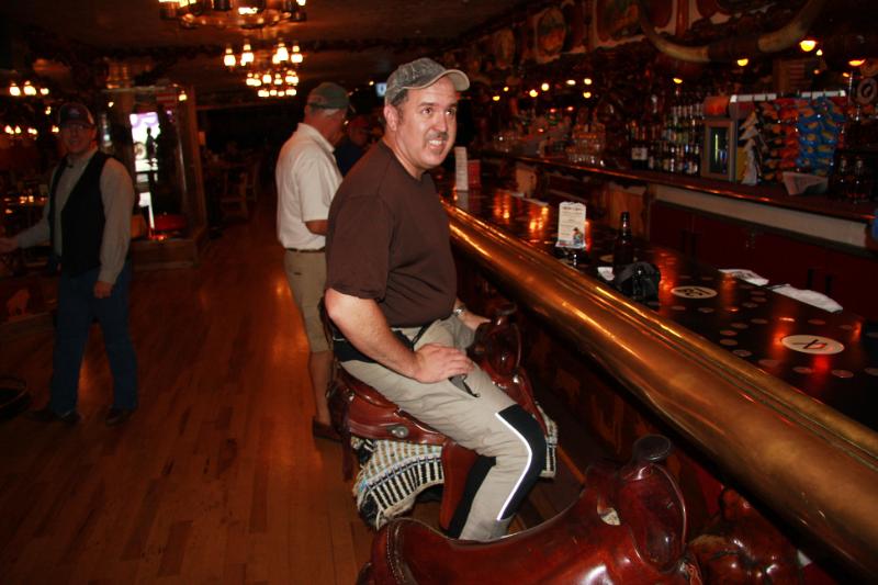 C09_5569.jpg - Rob on a saddle at the Million Dollar Cowboy Bar
