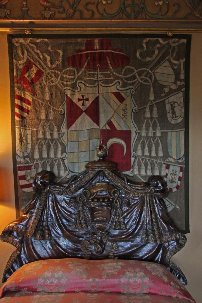 SSM_8595.jpg - I think this is the coolest bed in the entier place. The headboard and footboard were hand carved to look like draped tapestries. Absolutely amazing artistry, and I think it's over 200 years old.