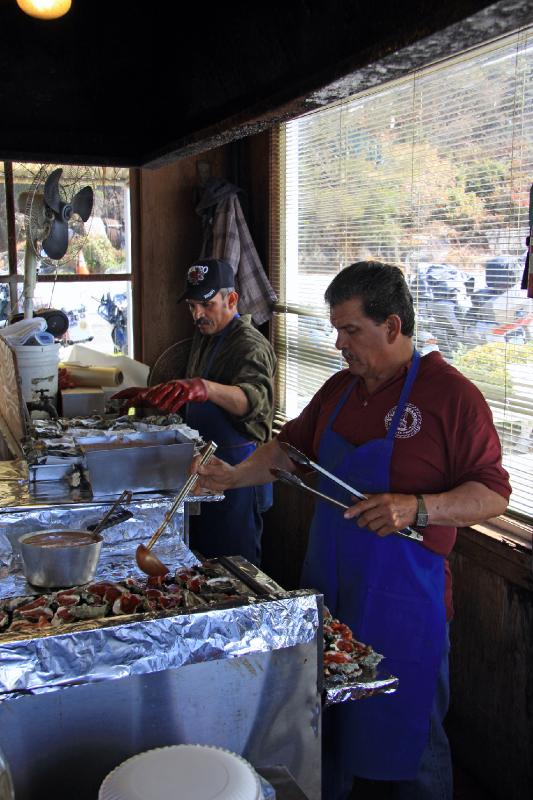 FB8_7017.jpg - The Masters at work, the guy on the left can shuck oysters faster than I've ever seen, the guy on the right has BBQ-ing oysters down to an art form