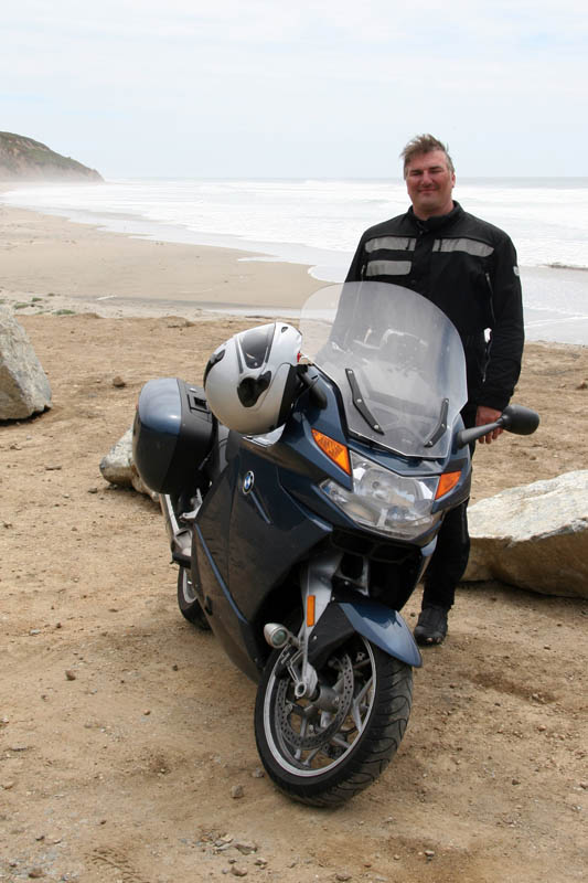 Joe, his bike, and the Pacific Ocean, proof he made it!