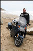 Joe, his bike, and the Pacific Ocean, proof he made it!