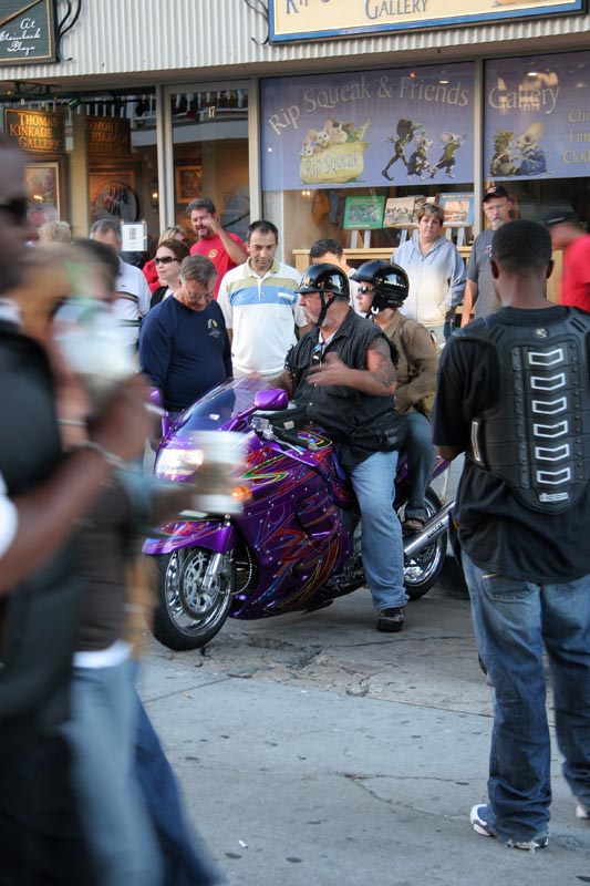 He seems so out of place on that bike