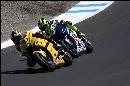 Guintoli being dogged by Rossi